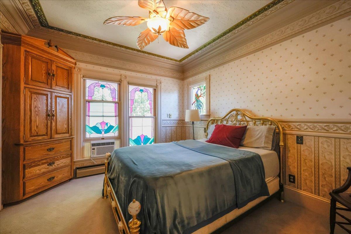 1167 Settle Avenue San Jose, CA 95125 - Photo 16 of 35 a bedroom with a bed and a chandelier