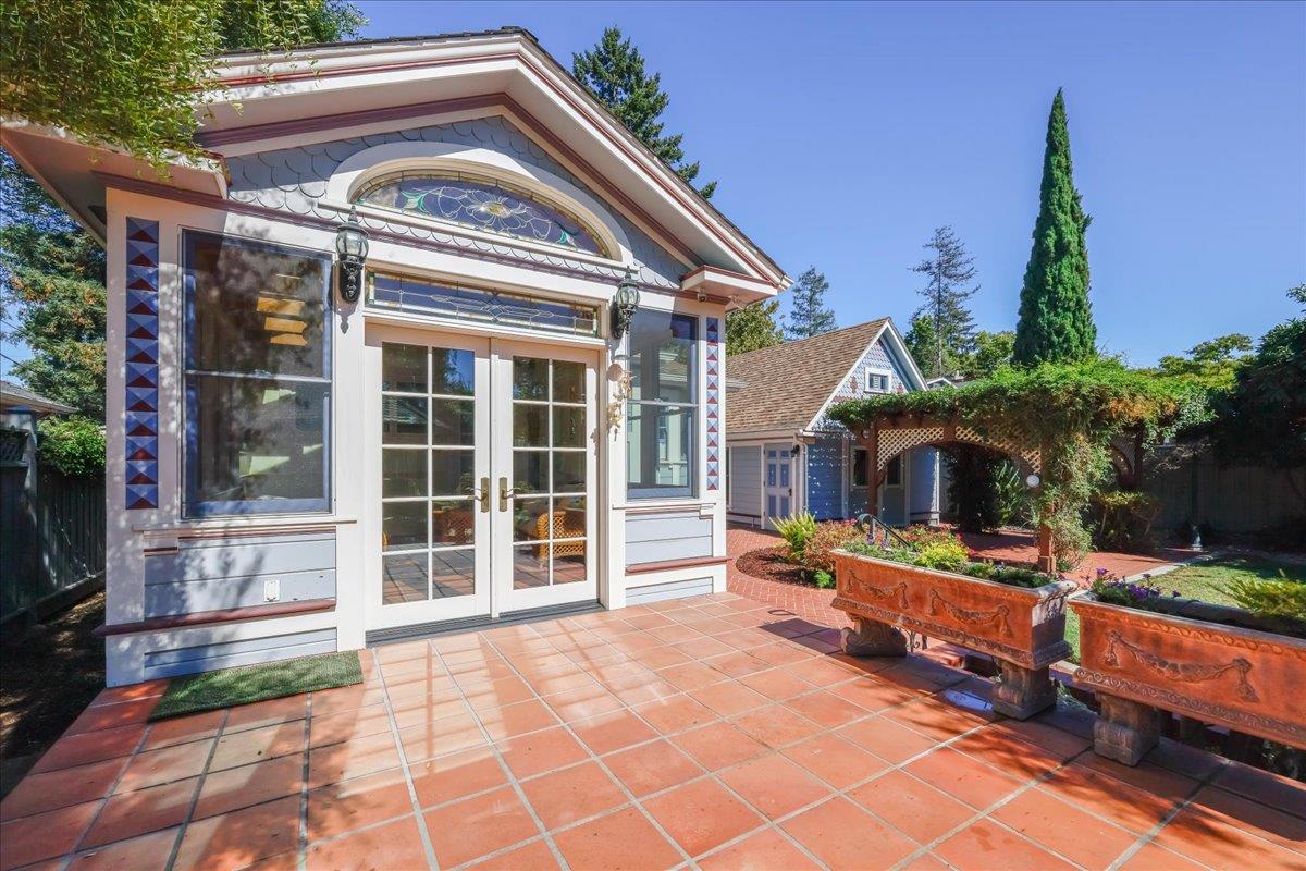 1167 Settle Avenue San Jose, CA 95125 - Photo 25 of 35 a front view of house with yard outdoor seating and covered with trees in the background
