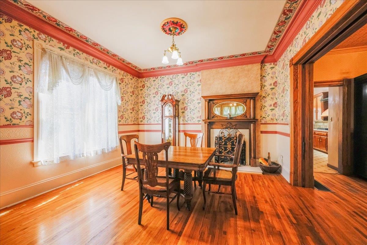 1167 Settle Avenue San Jose, CA 95125 - Photo 9 of 35 a view of a dining room with furniture wooden floor and a chandelier