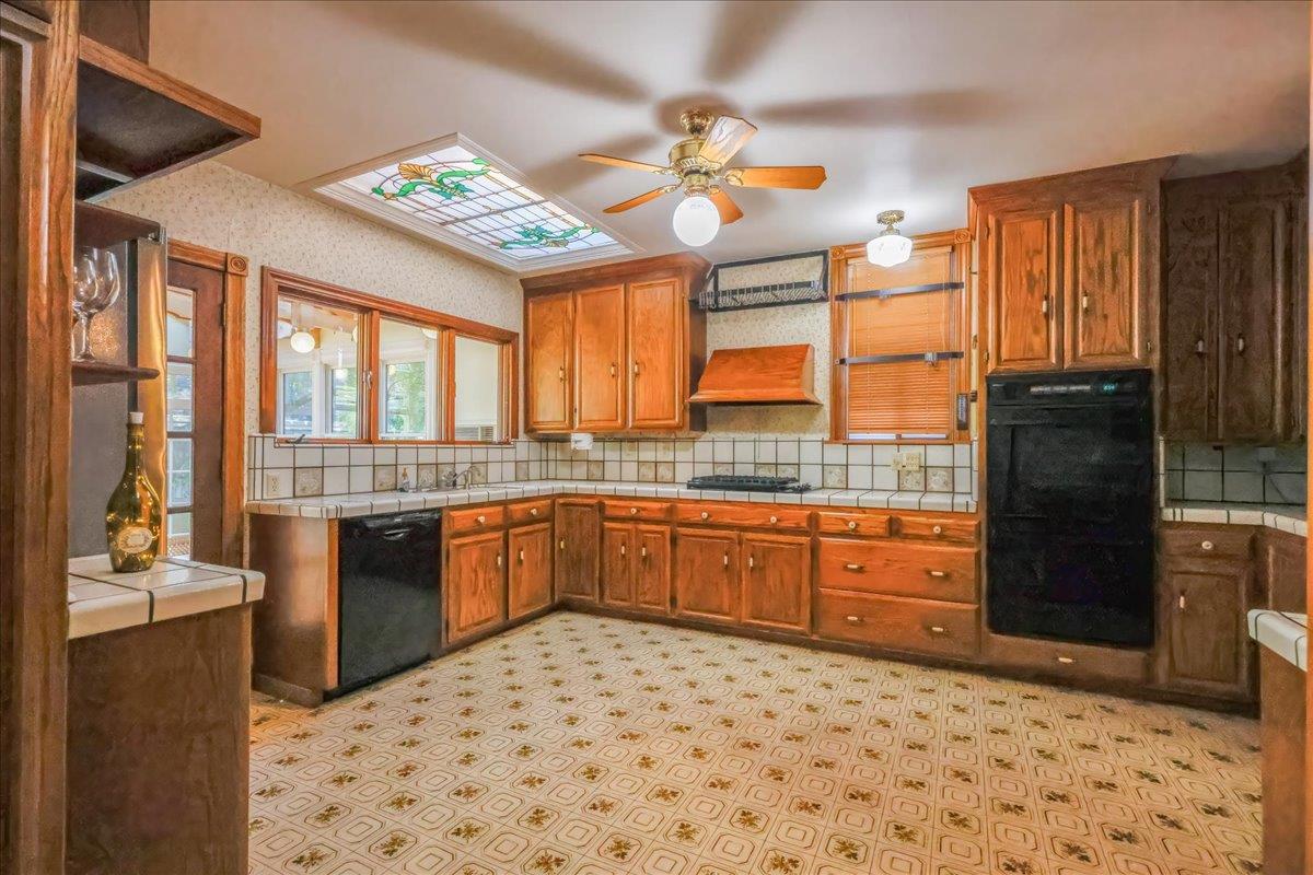 1167 Settle Avenue San Jose, CA 95125 - Photo 10 of 35 a large kitchen with a large window appliances and cabinets