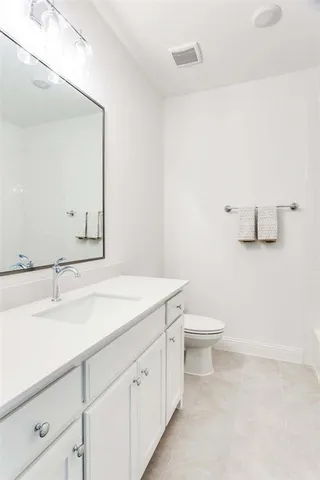 a picture of a book and a white bed