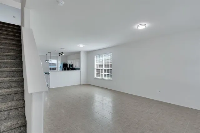 a view of a kitchen with a sink and cabinets