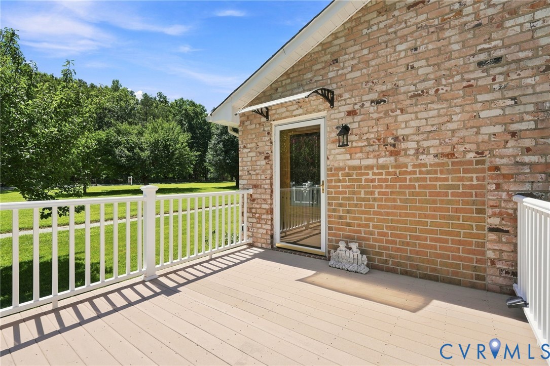 Large outdoor deck [1 of 2 decks] with a glass, st