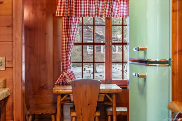 a dining room with furniture and window