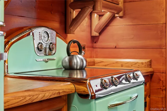 a kitchen that has a sink and a stove
