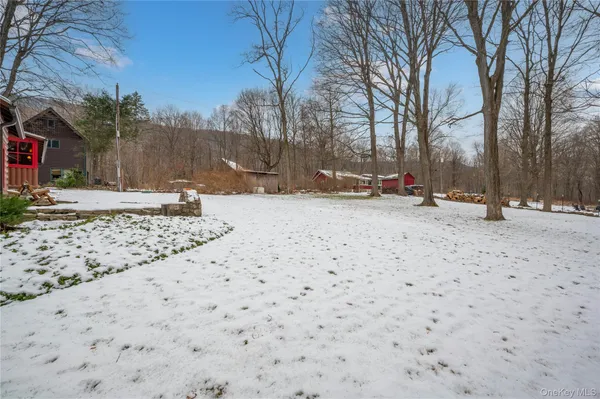 a view of backyard with sitting area and umbrella