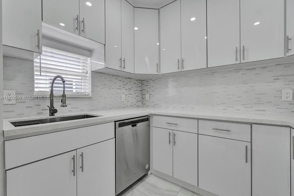 6470 Southwest 27th Street Miami, FL 33155 - Photo 11 of 38 a kitchen with a sink and cabinets