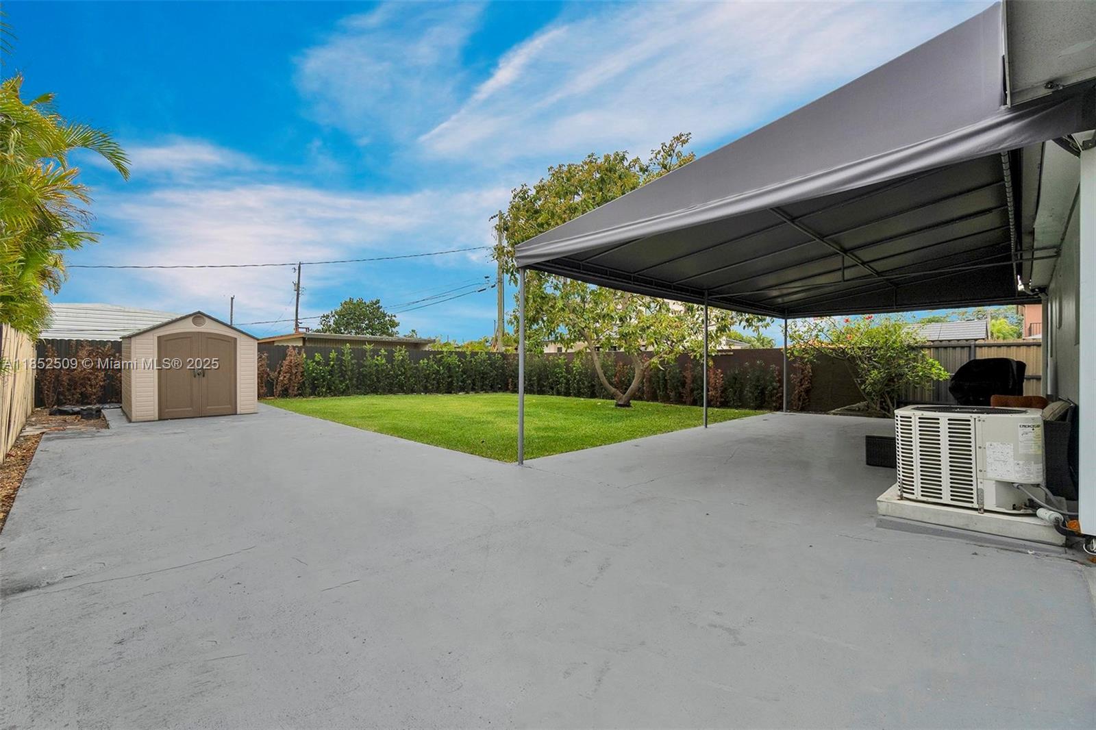 6470 Southwest 27th Street Miami, FL 33155 - Photo 34 of 38 a view of a house with backyard and basketball ground