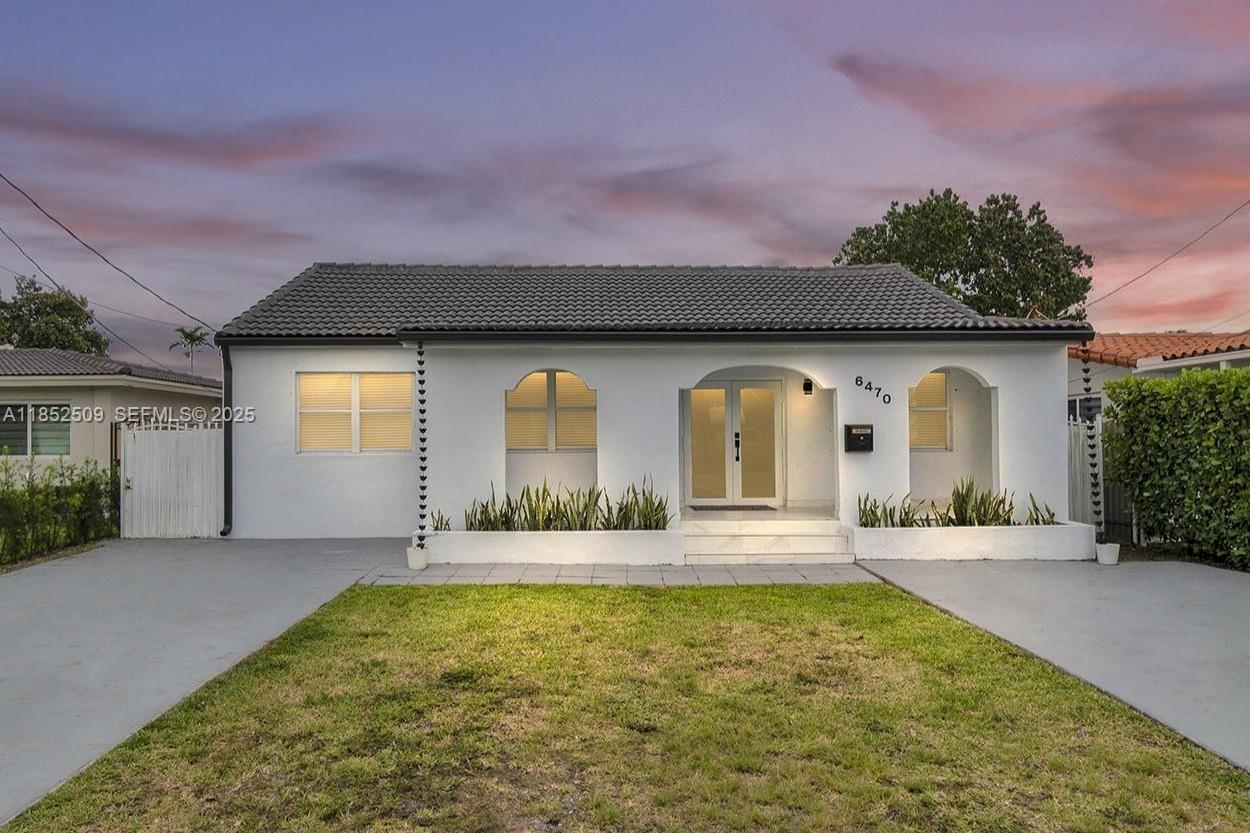 6470 Southwest 27th Street Miami, FL 33155 - Photo 4 of 38 a house with swimming pool in front of it