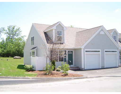 53 Brookview Road, Unit 2 4 Windham, NH 03087 - Photo 1 of 1 a front view of a house with a yard and garage