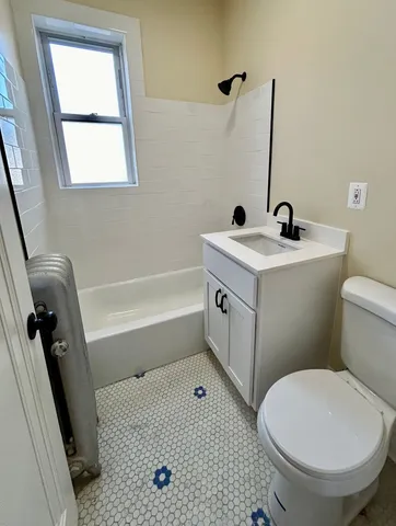 a bathroom with a sink a toilet and a bathtub