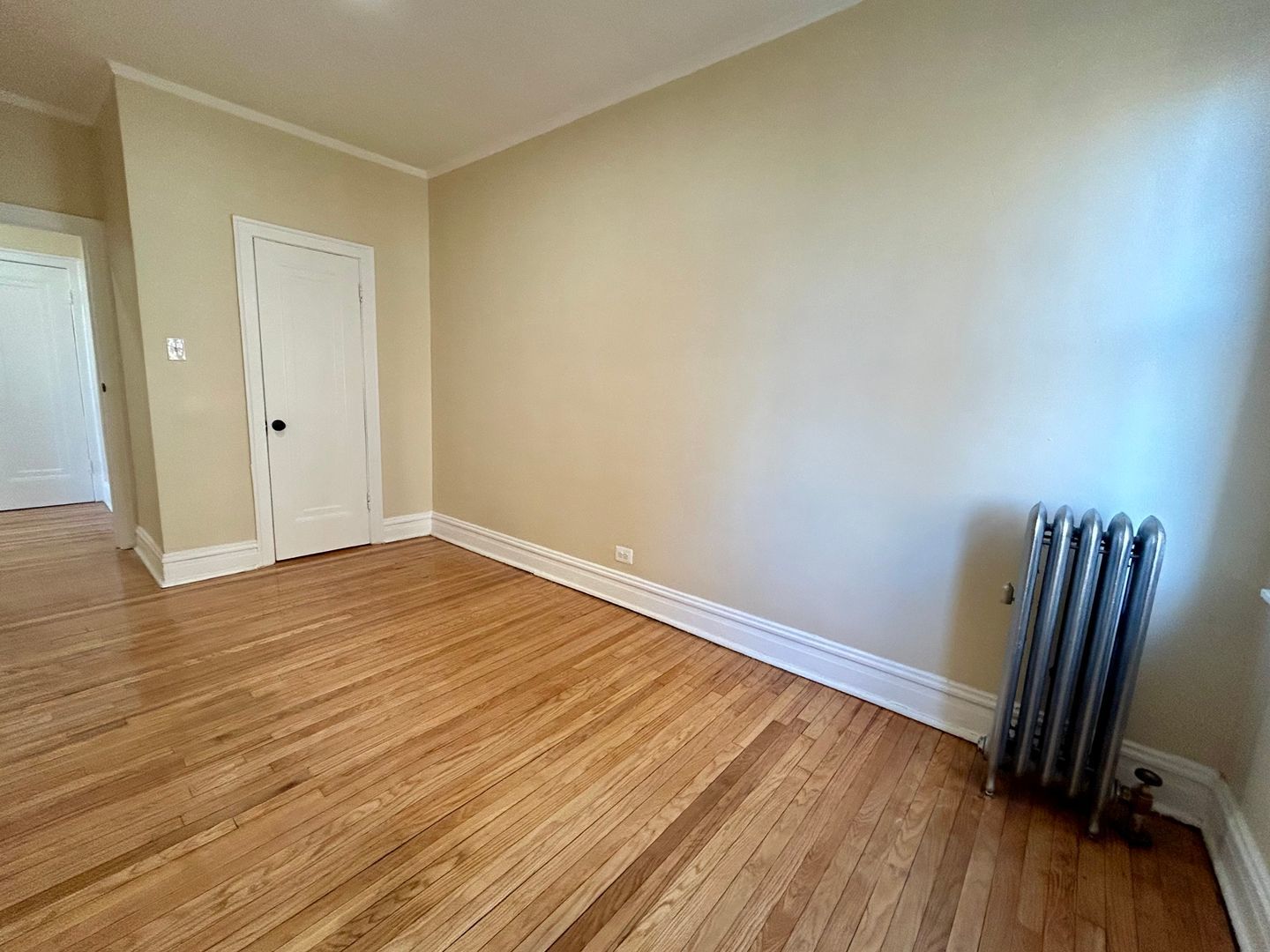 4045 West School Street, Unit 2N Chicago, IL 60641 - Photo 5 of 5 a view of room with wooden floor and chair
