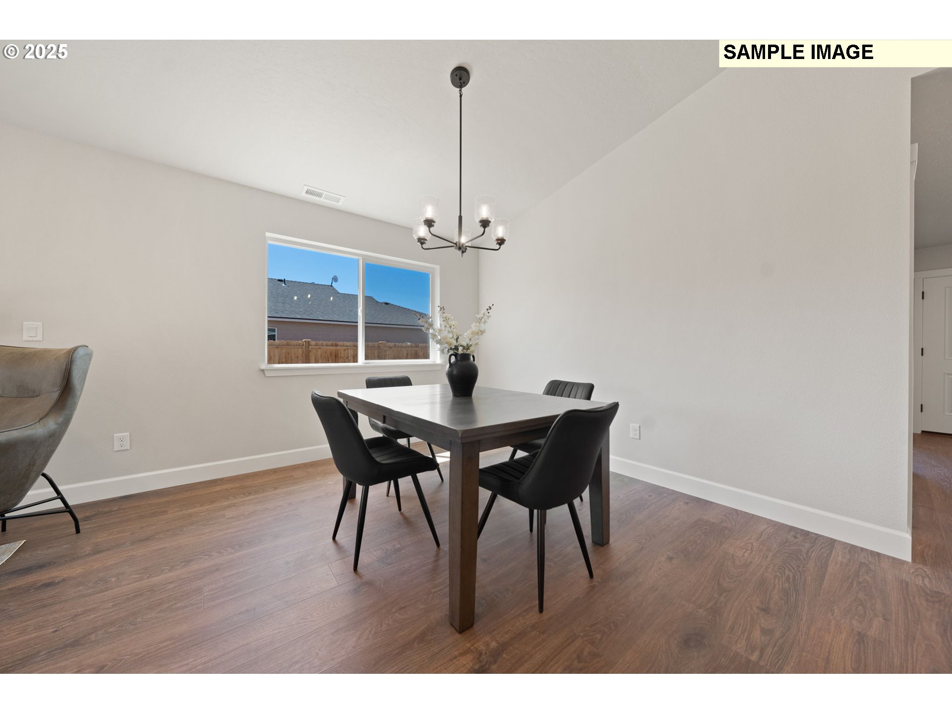 579 Arthur Street Umatilla, OR 97882 - Photo 11 of 31 a view of a dining room with furniture and wooden floor