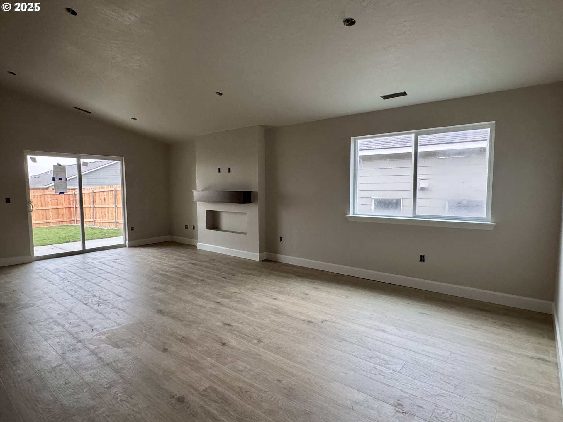 579 Arthur Street Umatilla, OR 97882 - Photo 29 of 31 an empty room with wooden floor and windows