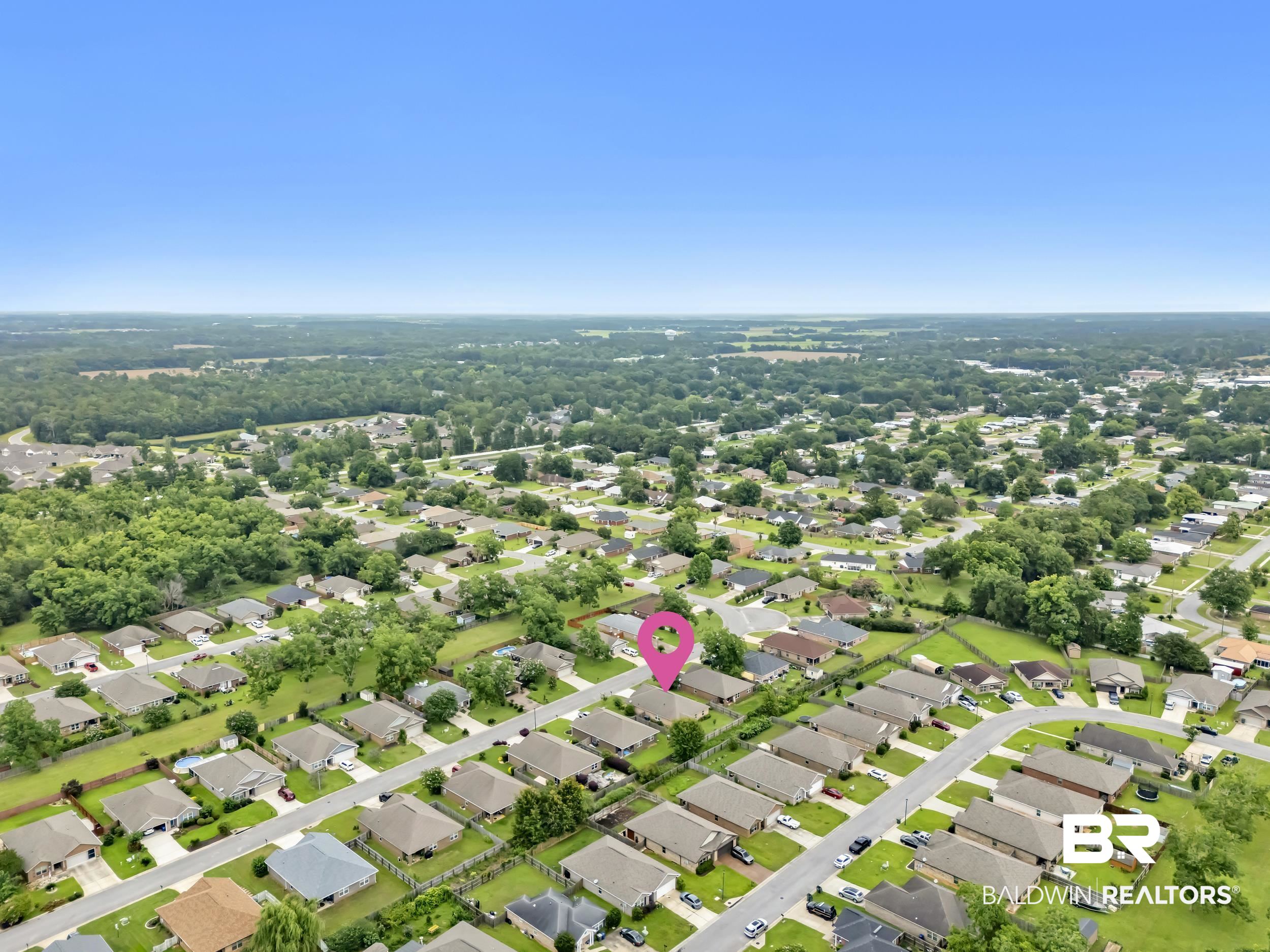 1704 Abbey Loop Foley, AL 36535 - Photo 36 of 38 Aerial perspective of a residential neighborhood with a uniform street grid
