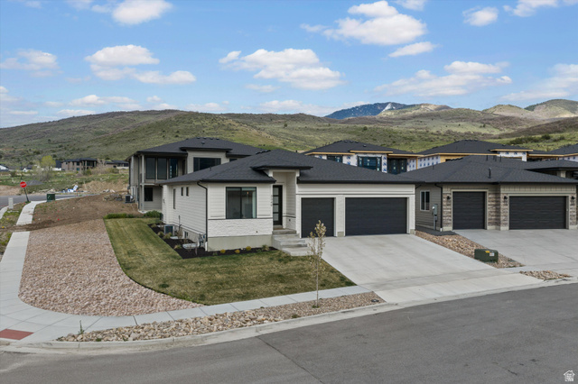 3349 Oxford Loop Morgan, UT 84050 - Photo 39 of 47 Prairie-style house featuring a mountain view, an attached garage, and concrete driveway