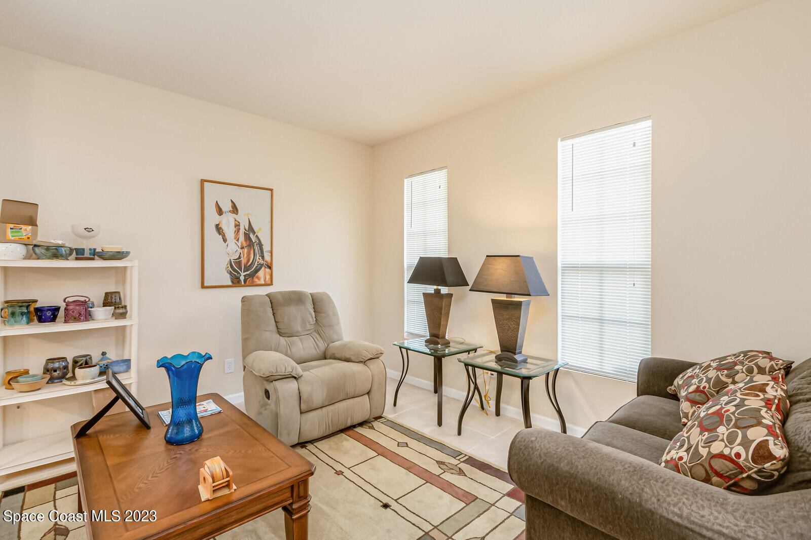 881 Benton Drive Melbourne, FL 32901 - Photo 12 of 34 a living room with furniture and a window