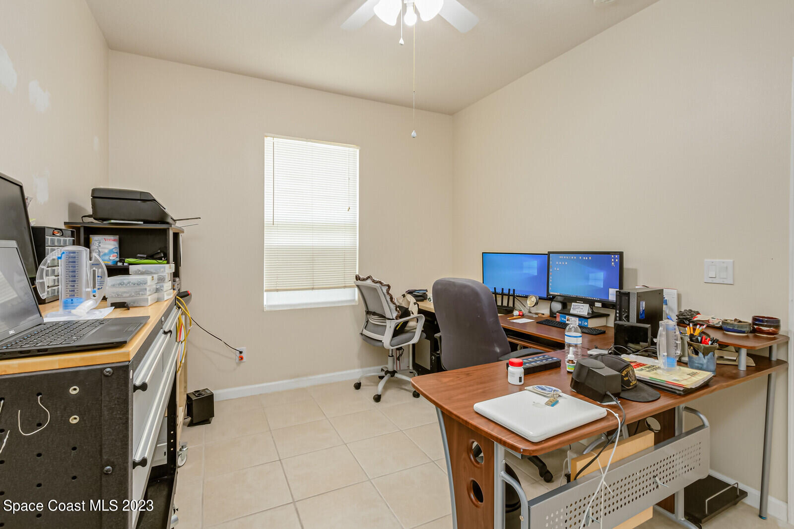 881 Benton Drive Melbourne, FL 32901 - Photo 17 of 34 a workspace with furniture and a window