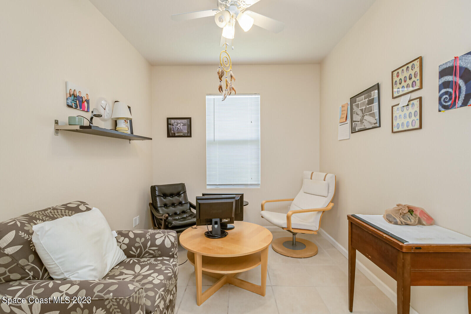 881 Benton Drive Melbourne, FL 32901 - Photo 19 of 34 a living room with furniture and a table
