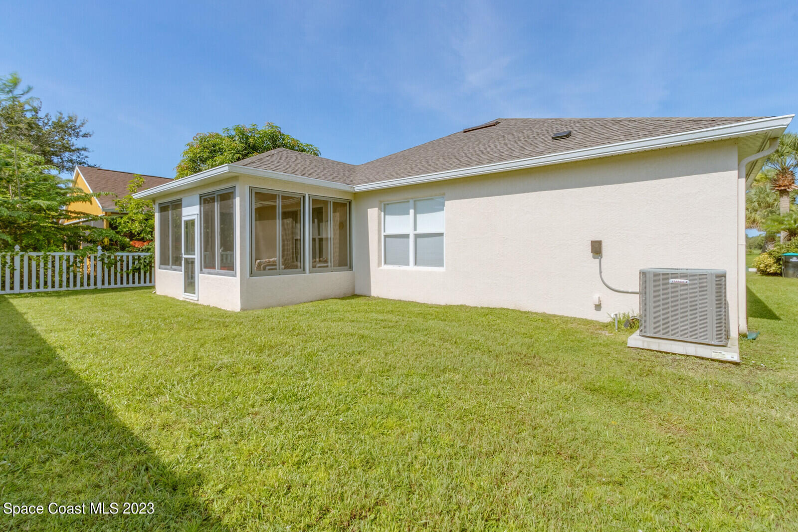 881 Benton Drive Melbourne, FL 32901 - Photo 24 of 34 a front view of a house with a garden