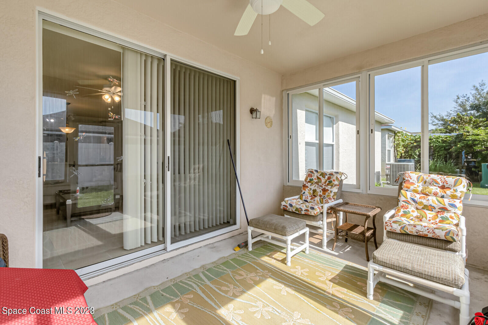 881 Benton Drive Melbourne, FL 32901 - Photo 26 of 34 a outdoor space with furniture and large windows