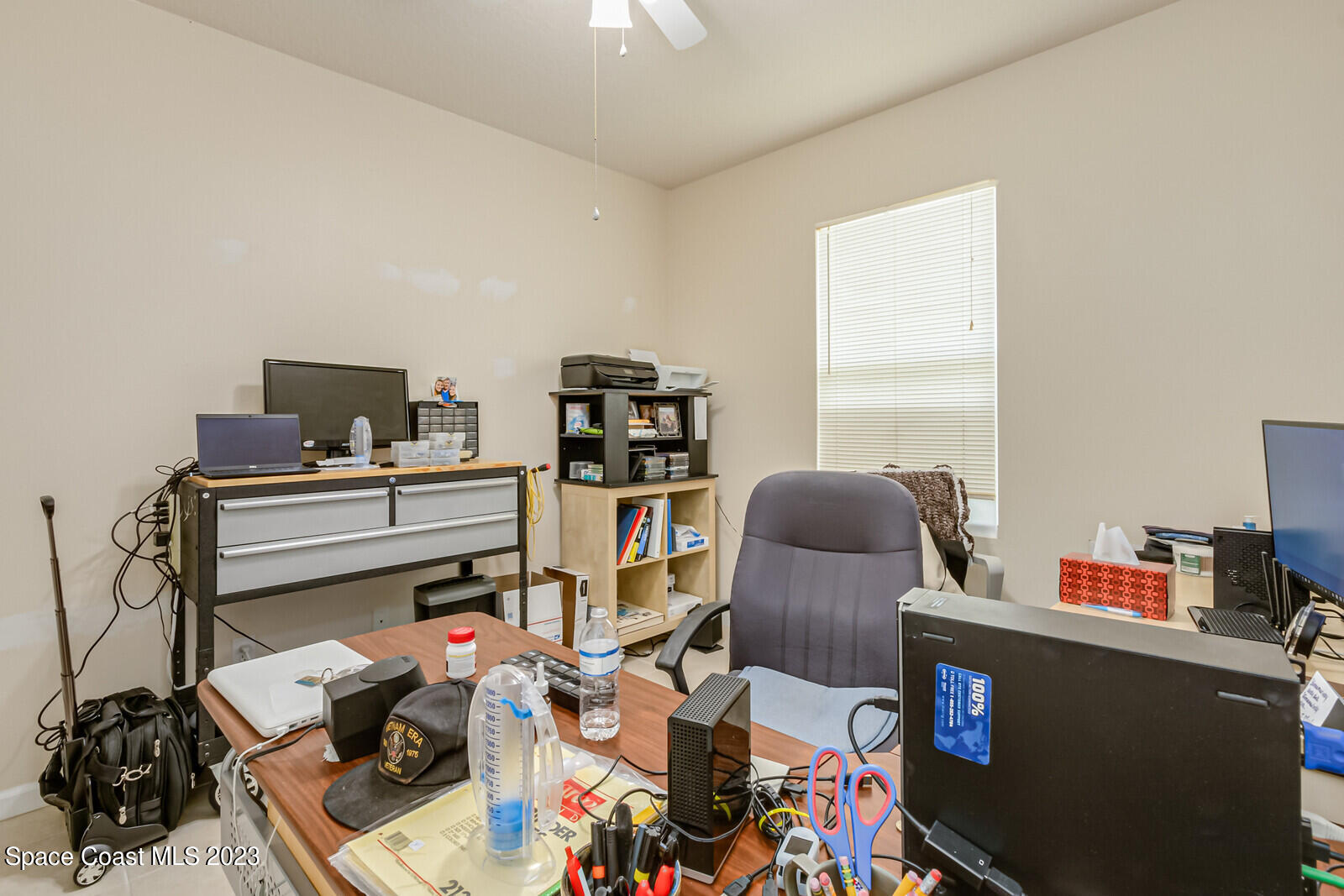 881 Benton Drive Melbourne, FL 32901 - Photo 27 of 34 a workspace with furniture and a window