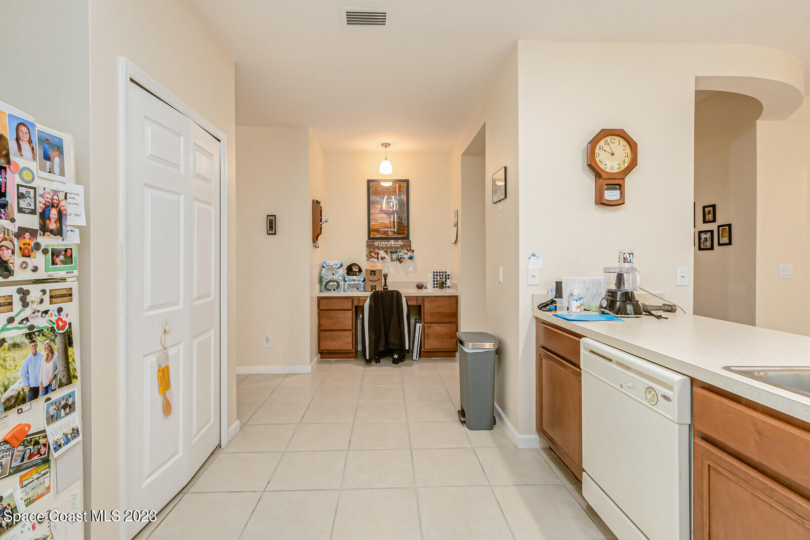 881 Benton Drive Melbourne, FL 32901 - Photo 29 of 34 a kitchen with stainless steel appliances a refrigerator and a stove
