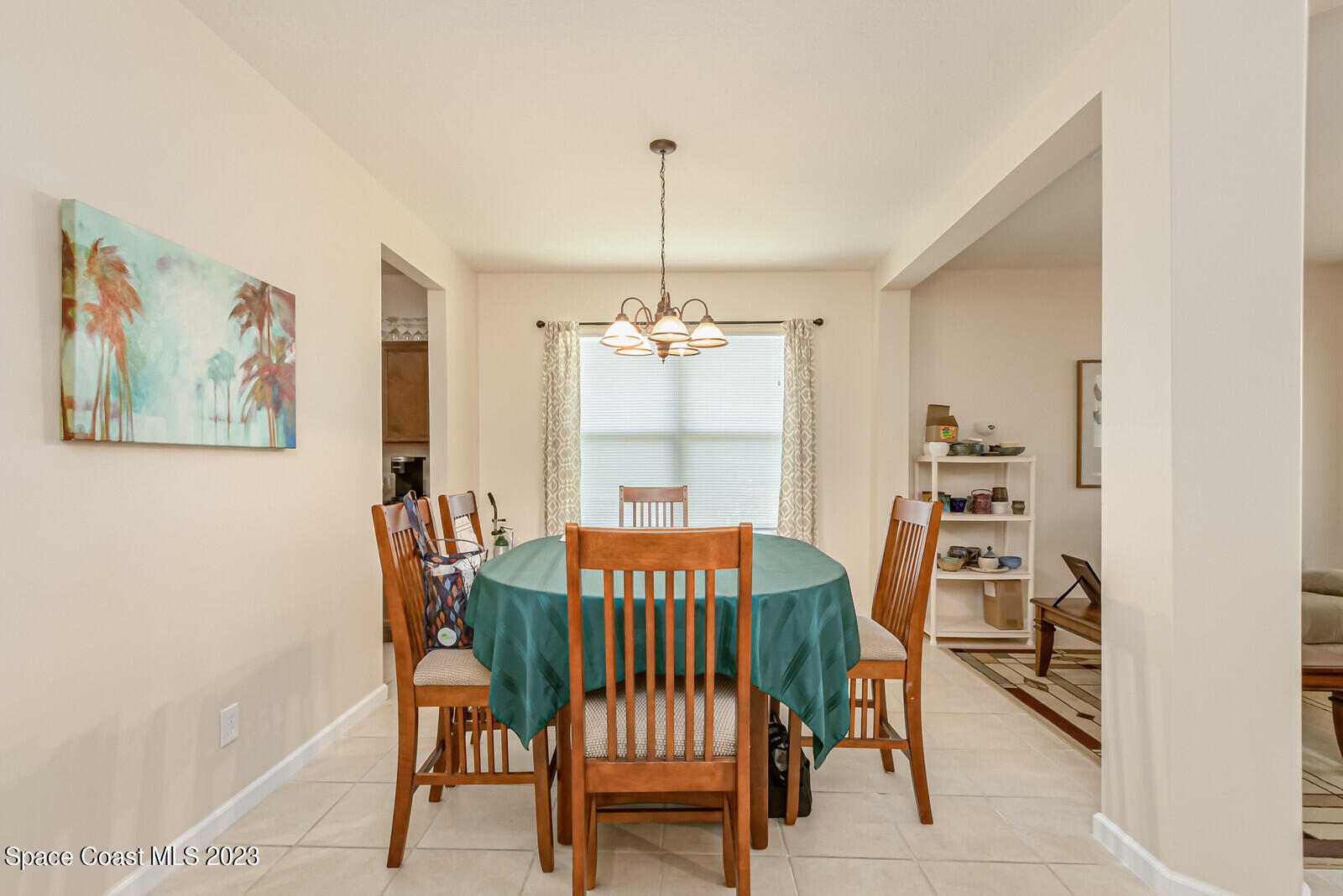 881 Benton Drive Melbourne, FL 32901 - Photo 31 of 34 a view of a dining room with furniture window and outside view