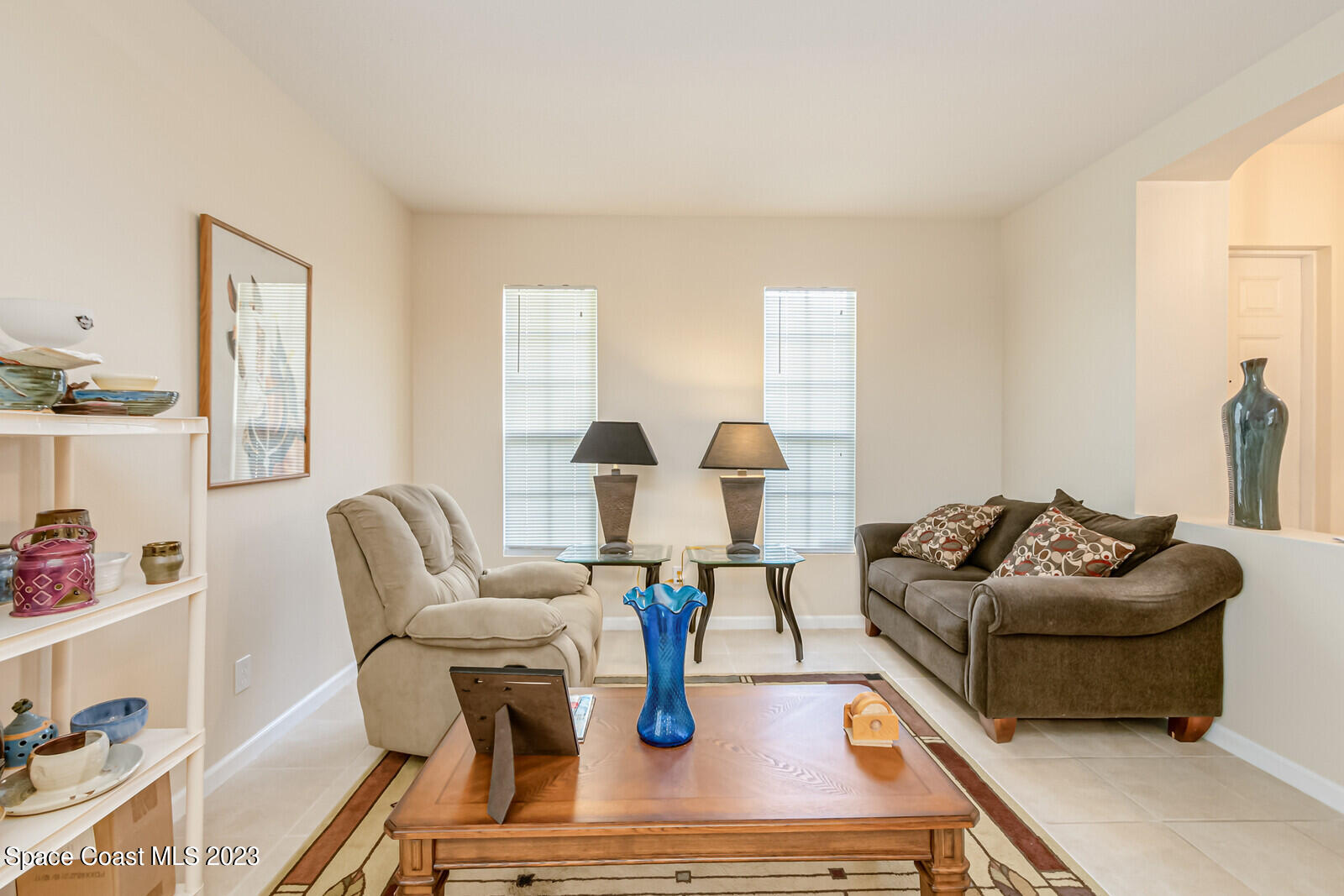 881 Benton Drive Melbourne, FL 32901 - Photo 32 of 34 a living room with furniture and wooden floor