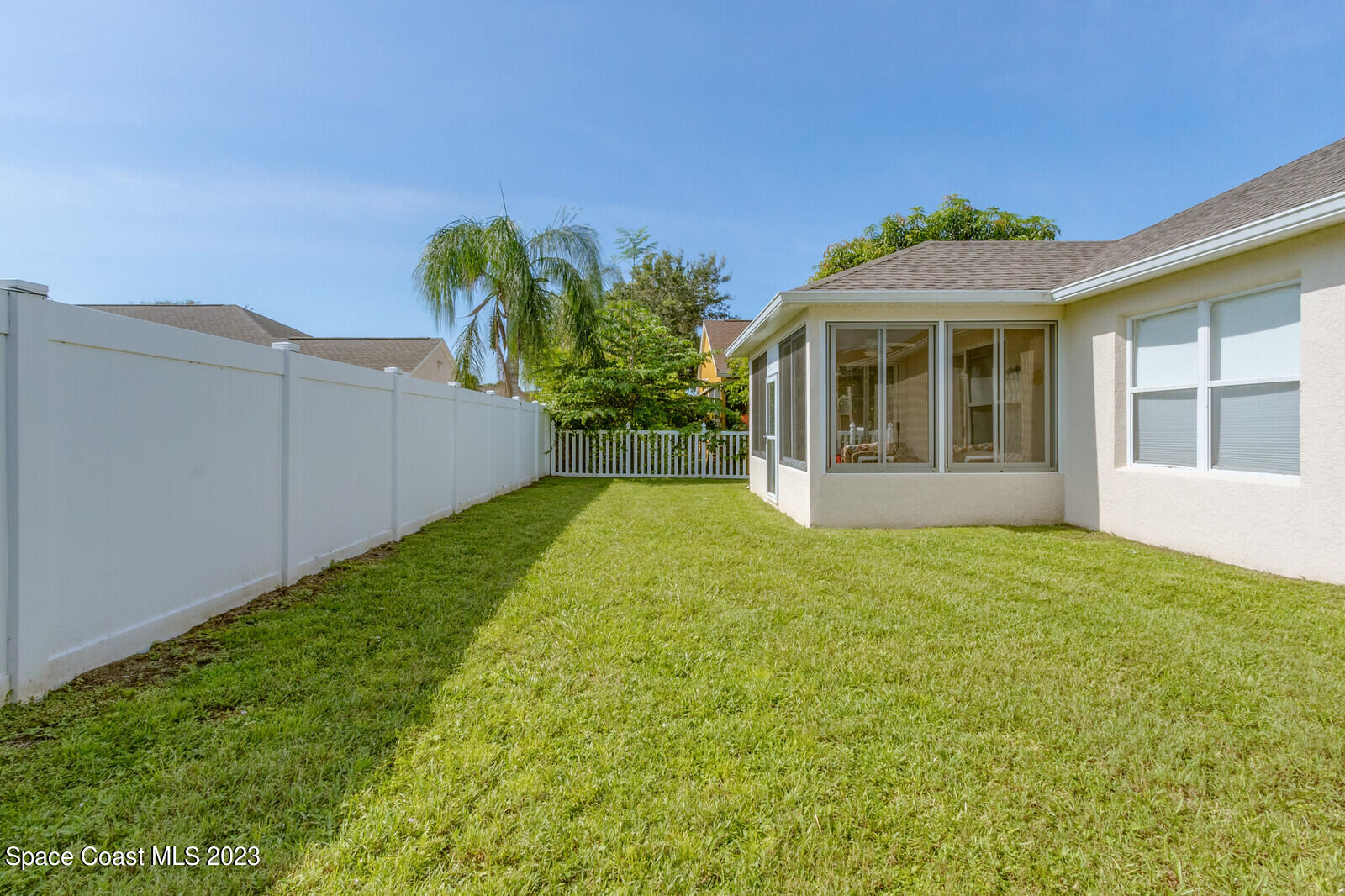 881 Benton Drive Melbourne, FL 32901 - Photo 4 of 34 a view of a house with a garden