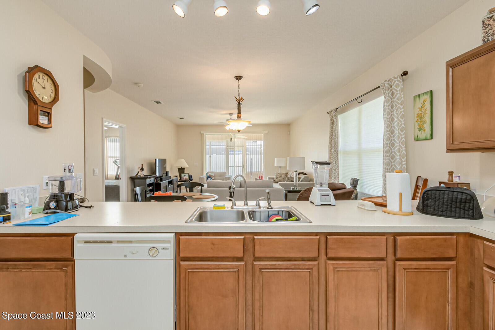881 Benton Drive Melbourne, FL 32901 - Photo 8 of 34 a kitchen with sink a stove and cabinets