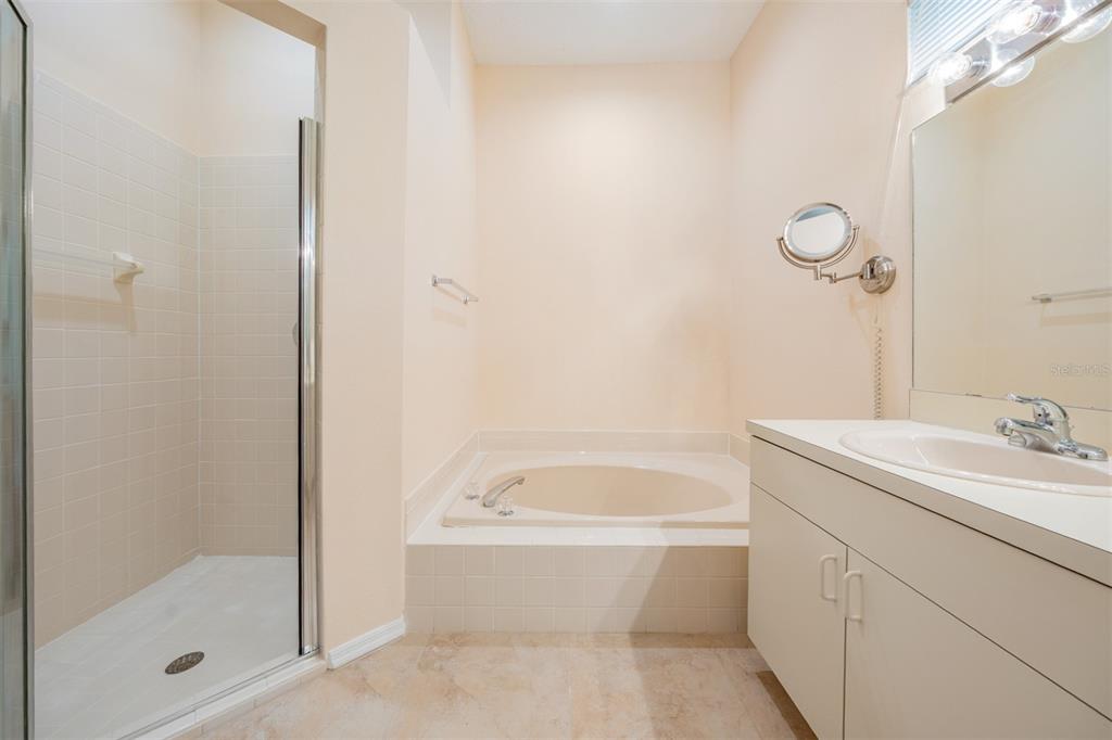 4504 Connery Court Palm Harbor, FL 34685 - Photo 14 of 33 a bathroom with a sink toilet and shower