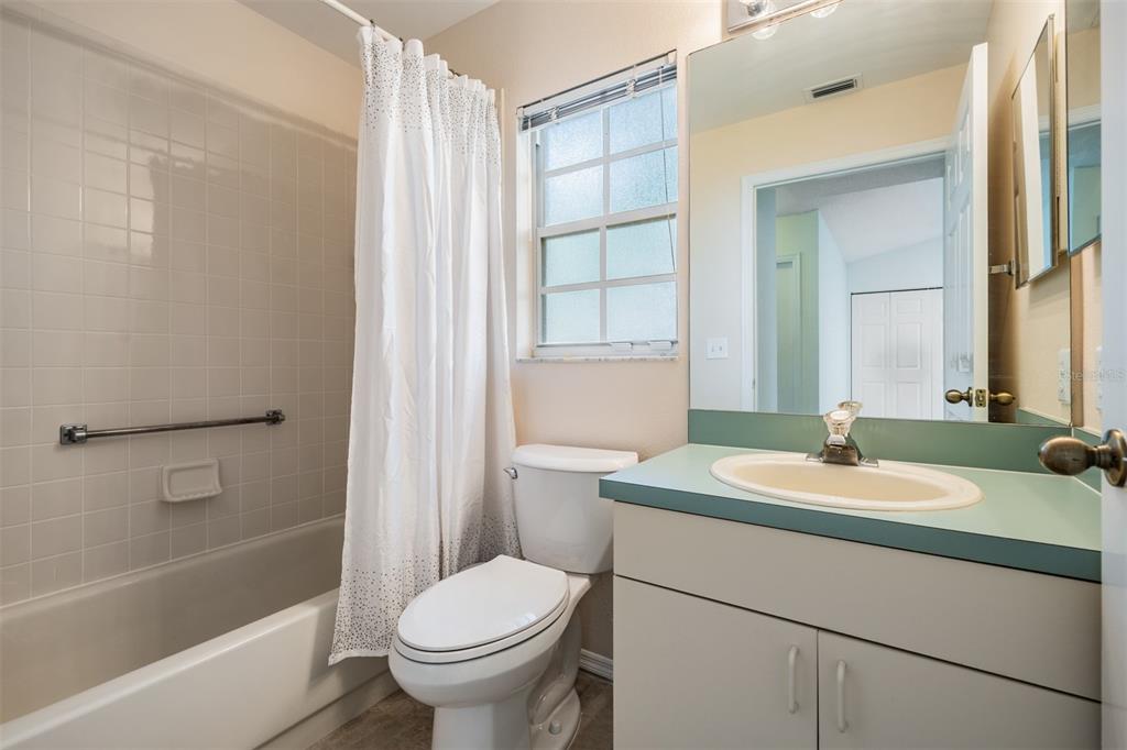 4504 Connery Court Palm Harbor, FL 34685 - Photo 17 of 33 a bathroom with a sink toilet and shower