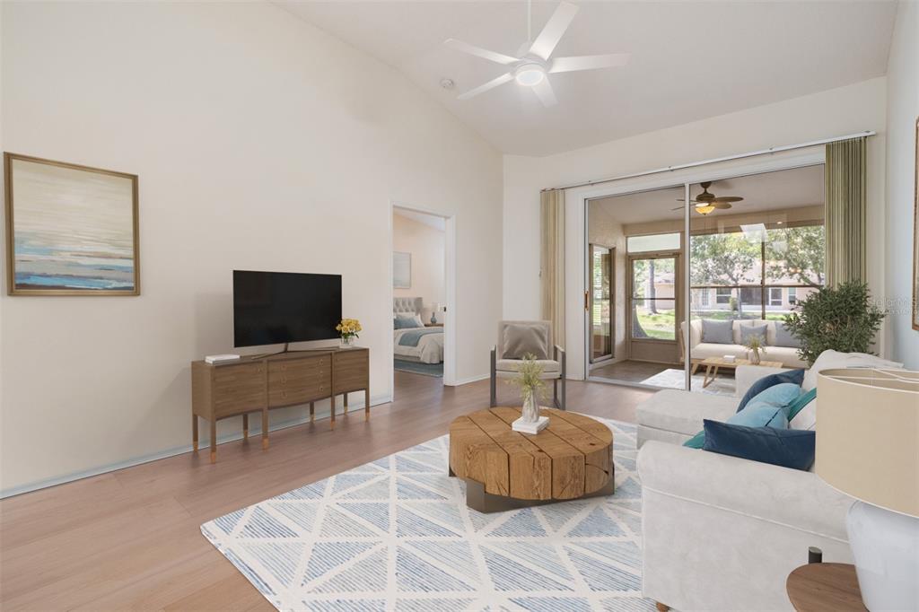 4504 Connery Court Palm Harbor, FL 34685 - Photo 5 of 33 a living room with furniture and a flat screen tv