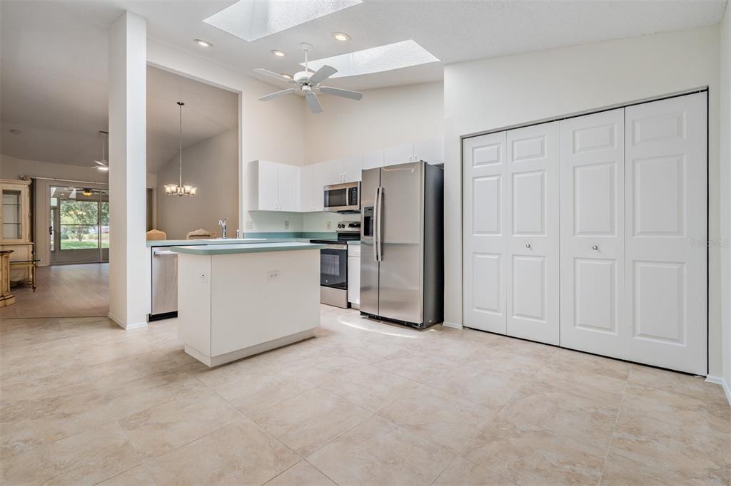 4504 Connery Court Palm Harbor, FL 34685 - Photo 10 of 33 a view of a kitchen with refrigerator and windows