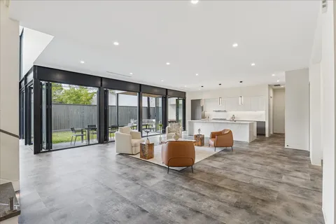 a bathroom with a tub sink shower and mirror