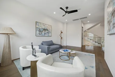 a bathroom with a granite countertop sink a toilet and shower