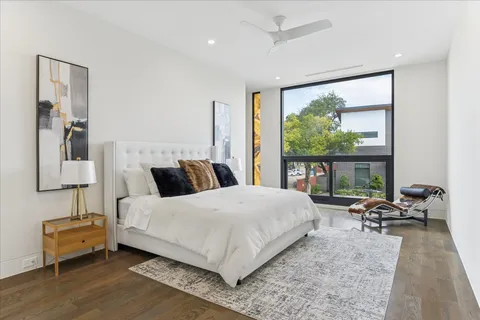 a bathroom with a granite countertop sink a toilet and a shower