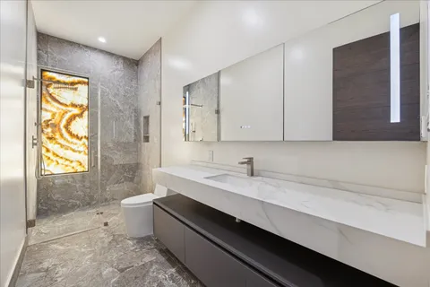 a front view of a house with outdoor seating