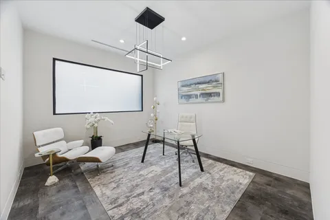 a bathroom with a granite countertop sink a toilet and a mirror