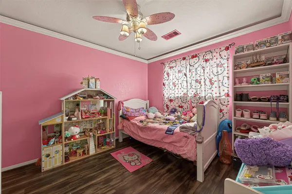a bed room with furniture and a book shelf