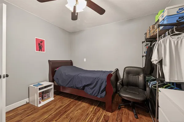 a bedroom with a bed and a couch