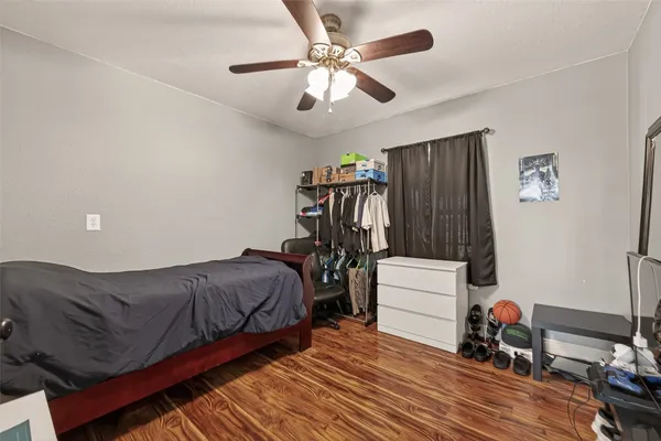 a bedroom with furniture and a chandelier