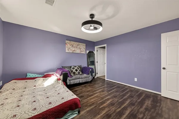 a bedroom with bed and a window