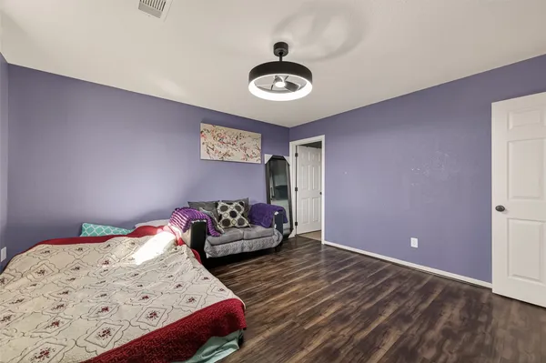 a bedroom with bed and a window