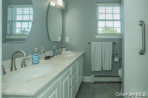 7 Valley Court Florida, NY 10921 - Photo 22 of 30 a bathroom with a double vanity sink and a window