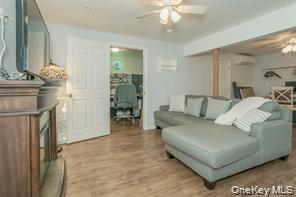7 Valley Court Florida, NY 10921 - Photo 24 of 30 a living room with furniture a dining table and a chandelier