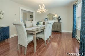 7 Valley Court Florida, NY 10921 - Photo 3 of 30 a view of a dining room with furniture and wooden floor
