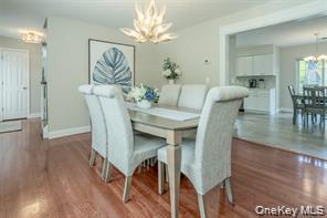 7 Valley Court Florida, NY 10921 - Photo 4 of 30 a view of a dining room with furniture and wooden floor