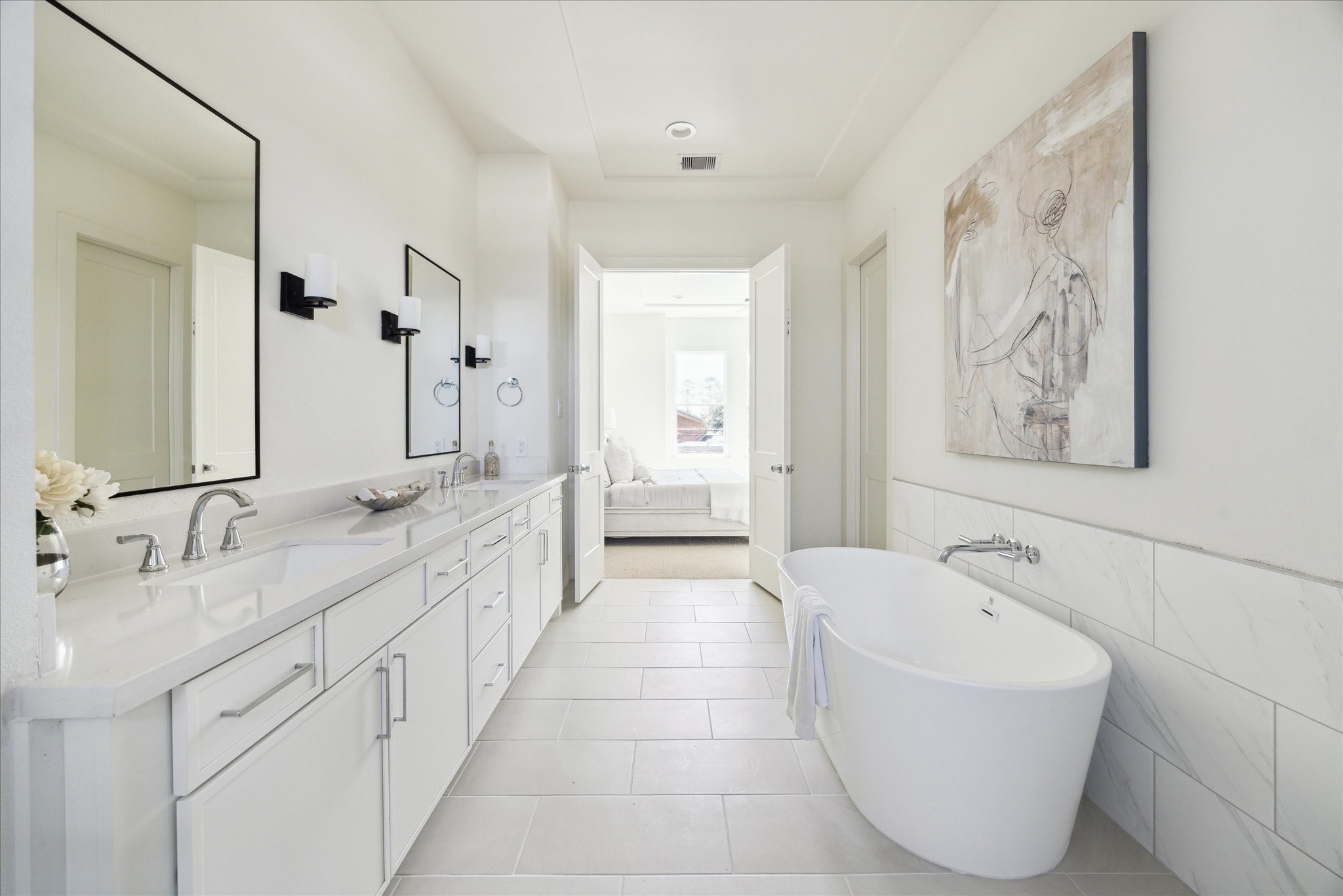 5309 Lambeth Riverside Drive Houston, TX 77091 - Photo 15 of 29 a spacious bathroom with a tub sink and mirror